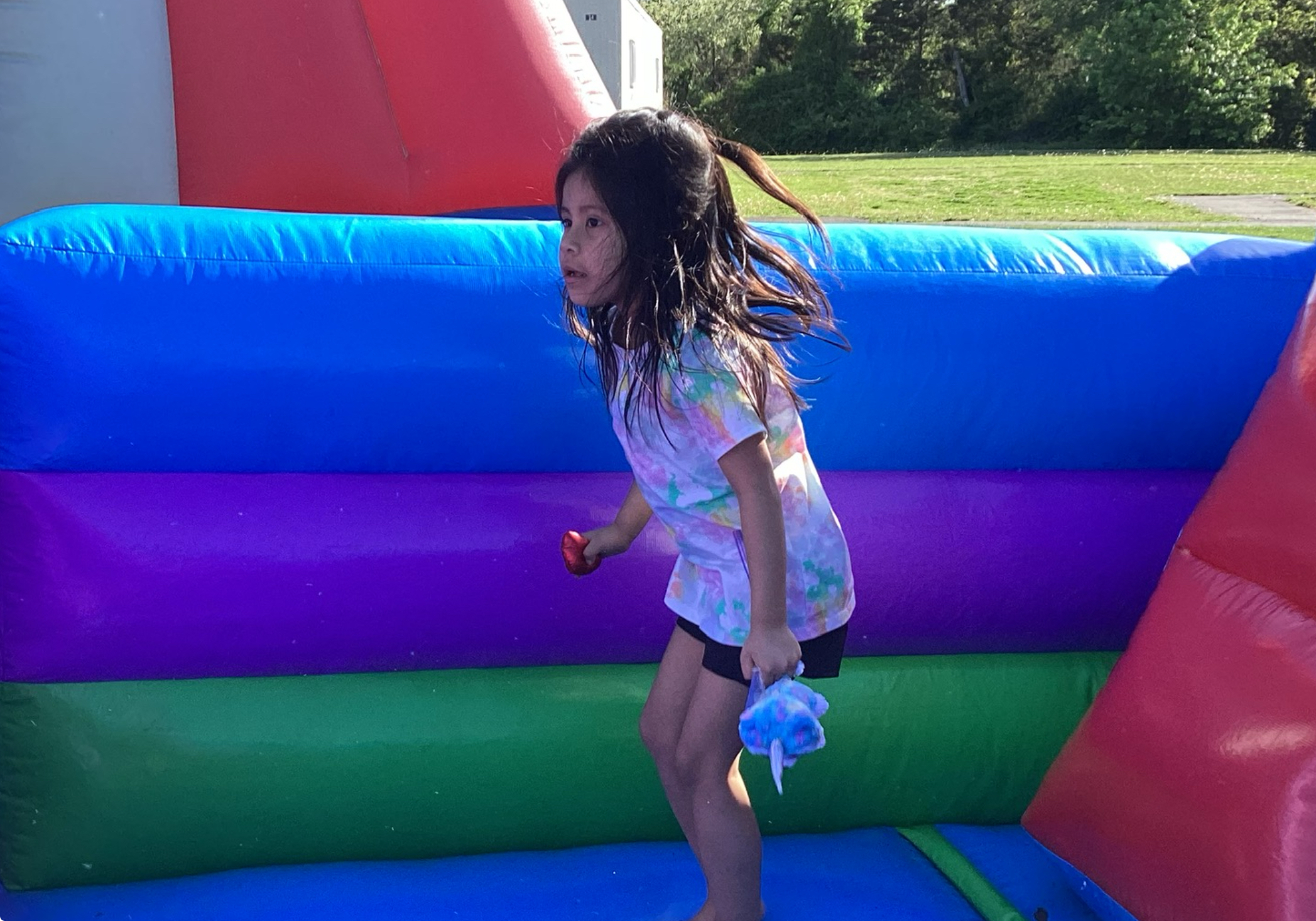 Girl jumping in bouncy house