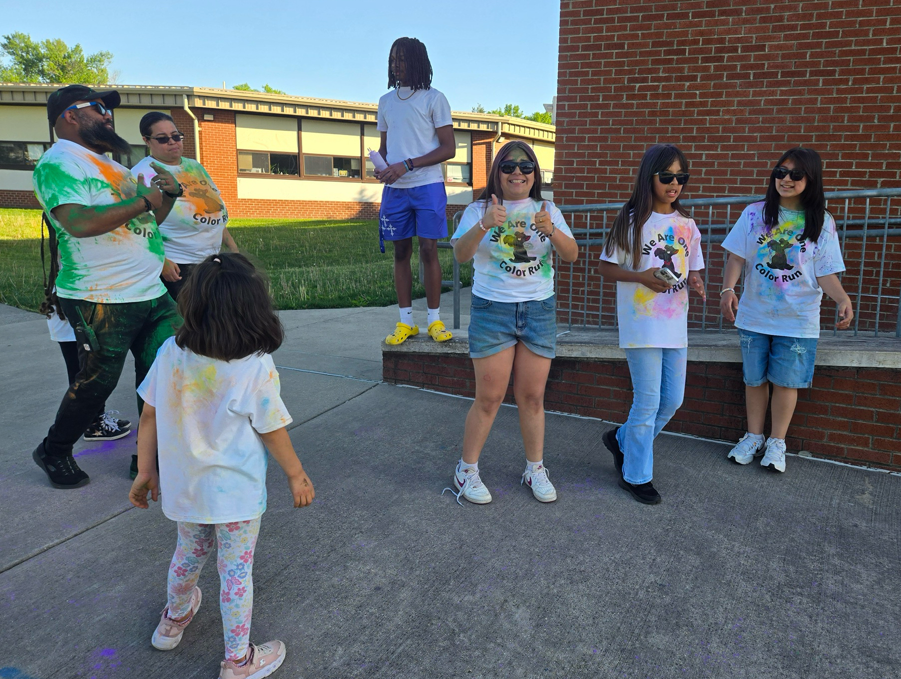 Students and staff resting during color run