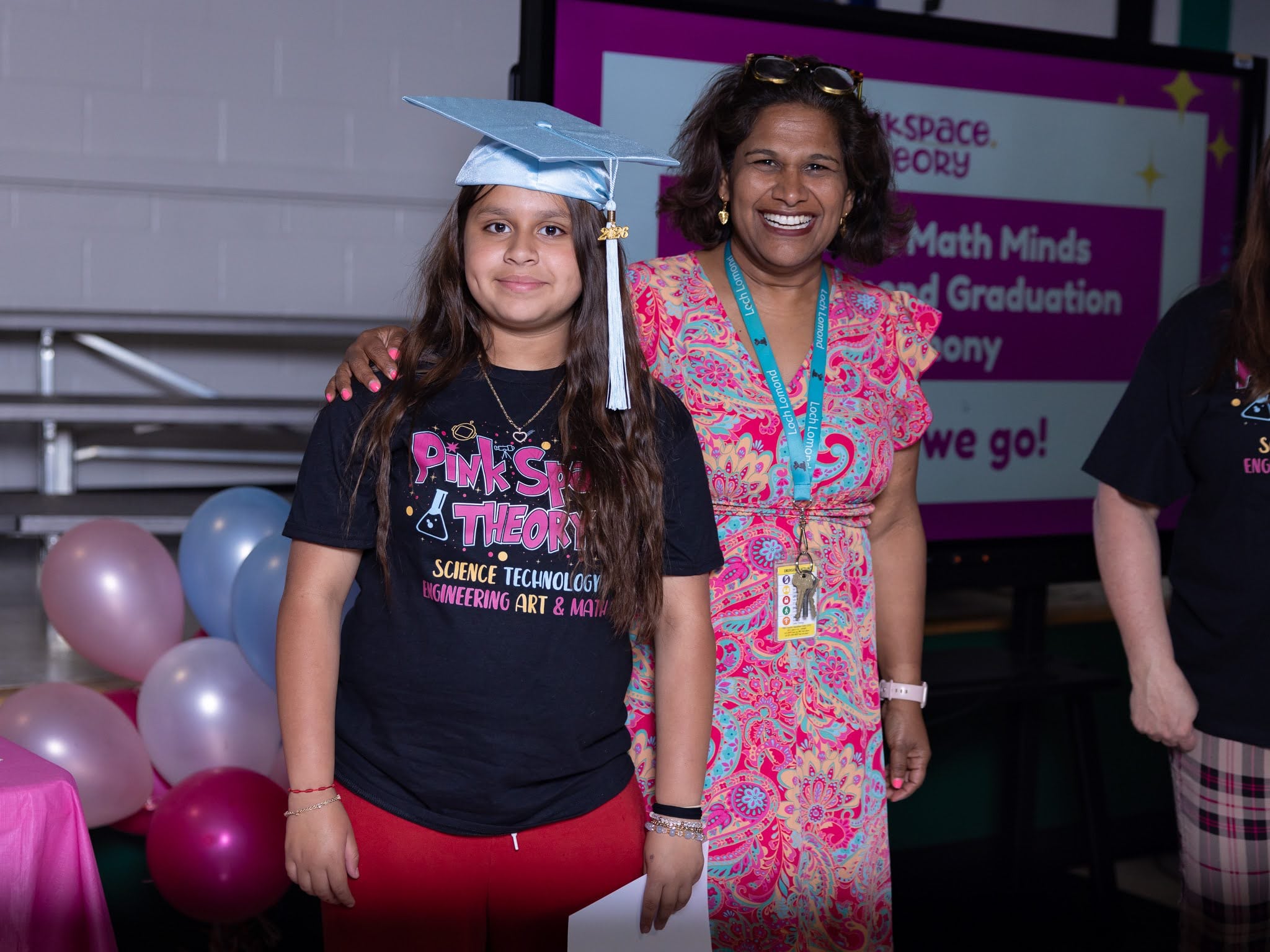 girls posing with principal