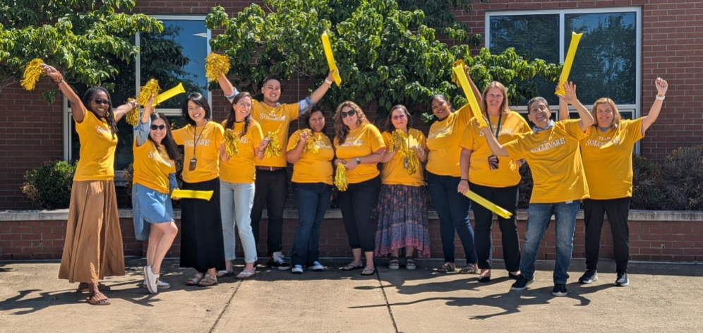 staff wearing yellow shirts